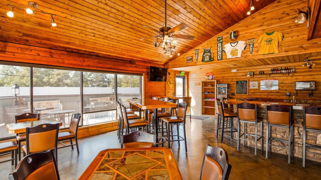 Bar with wood panelled ceiling and walls at the Black Hills Lodge