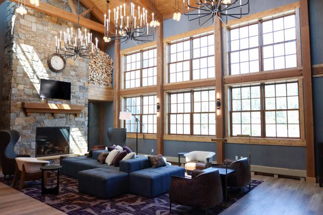 hotel lobby with fireplace and chandelier