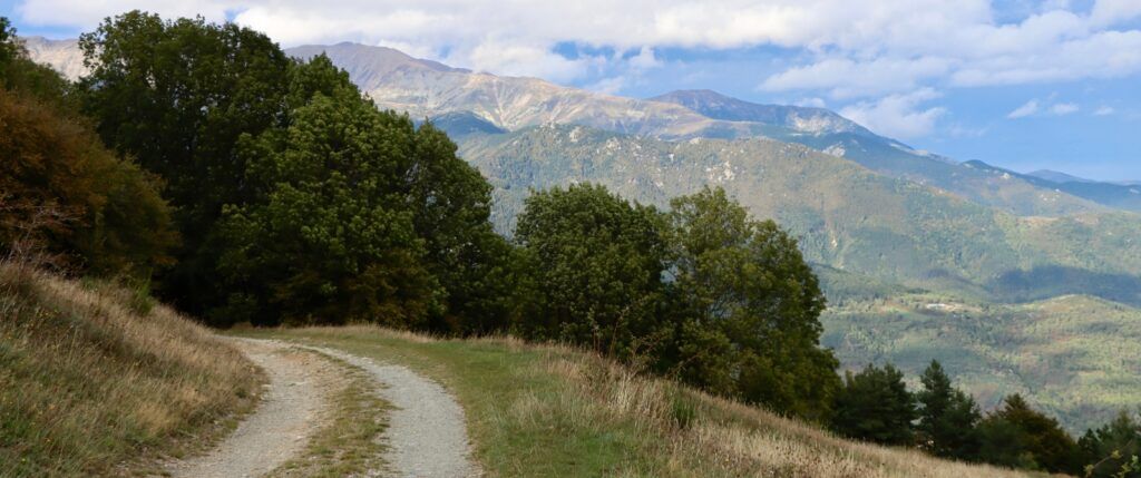 Double track gravel road overlooking mountains