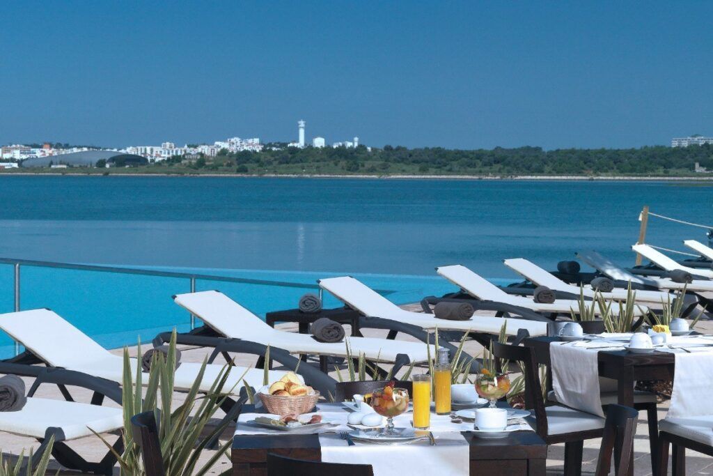 Sun chairs and breakfast tables at Agua Hotel and Spa Resort