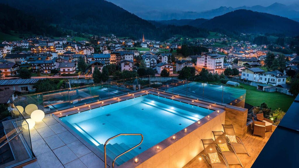 Night view of outdoor pool at Brunet resort