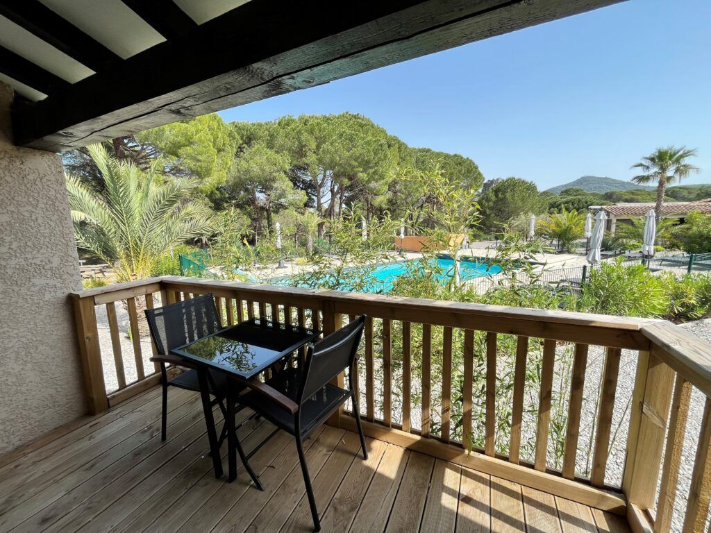 View of hotel pool from a deck at Auberge de Val Mourèze