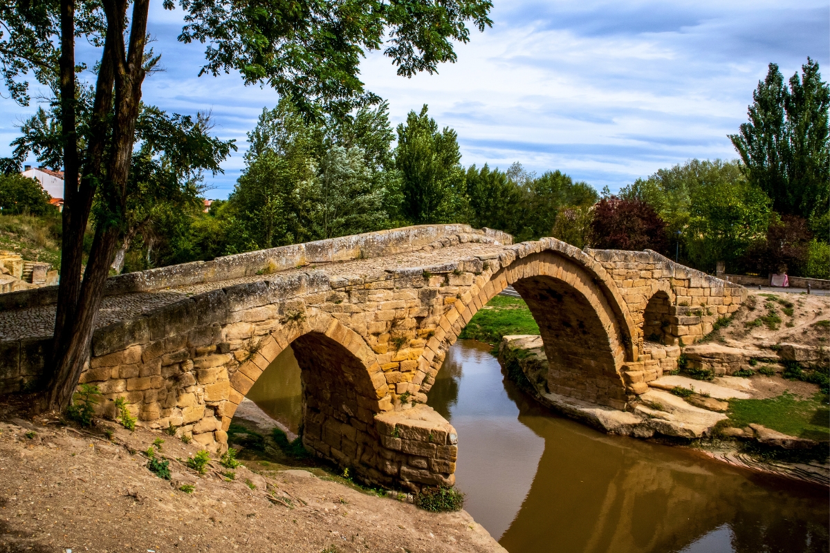 The stone Roman bridge in Cihuri over a river.