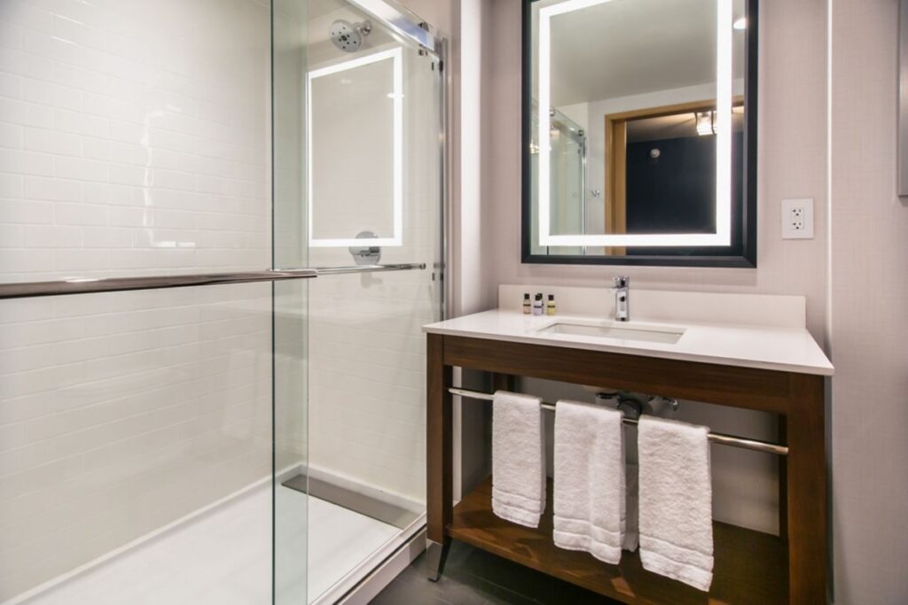 Hotel bathroom sink and shower