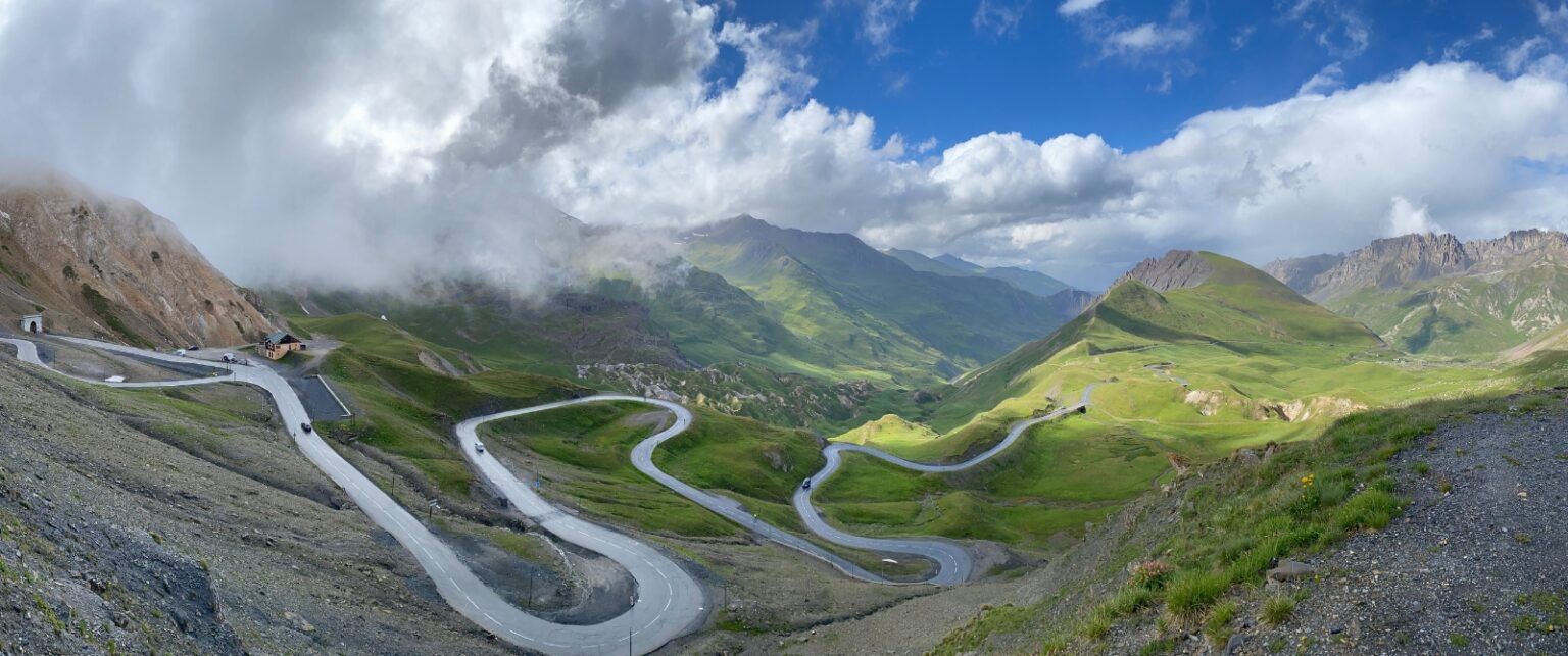 A panoramic vista of a winding mountain road