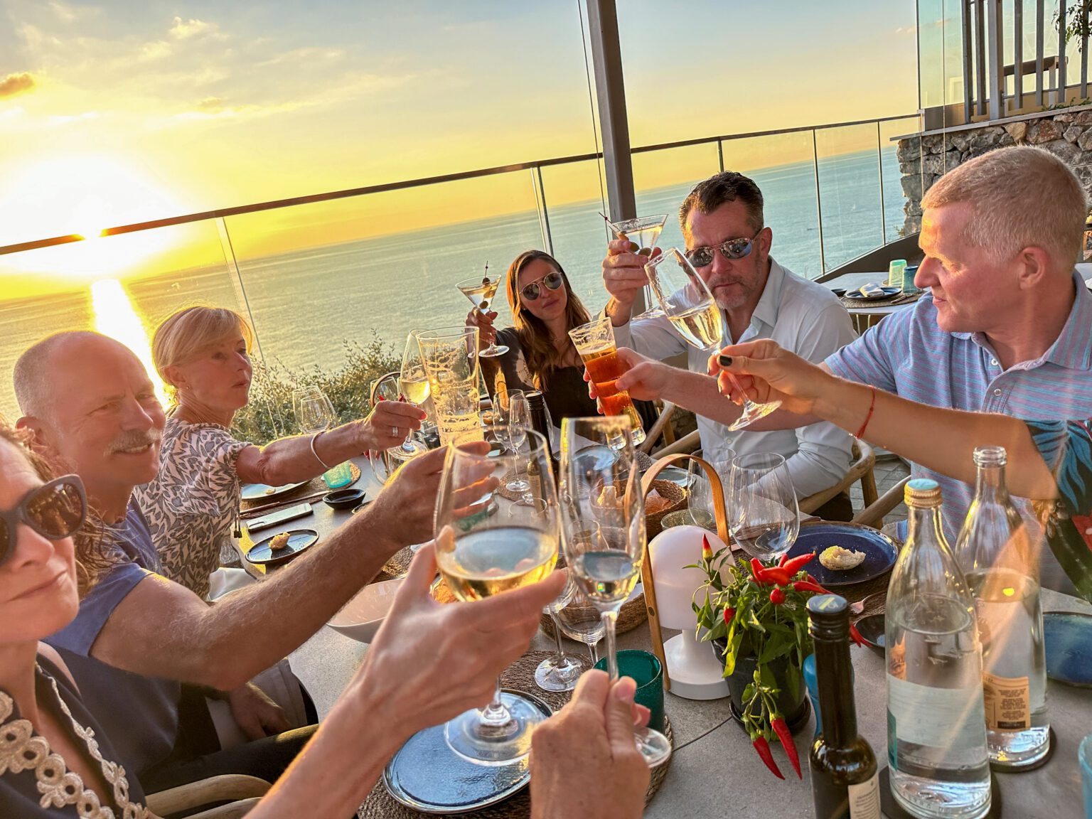 A group of people toasting with glasses of wine in Mallorca