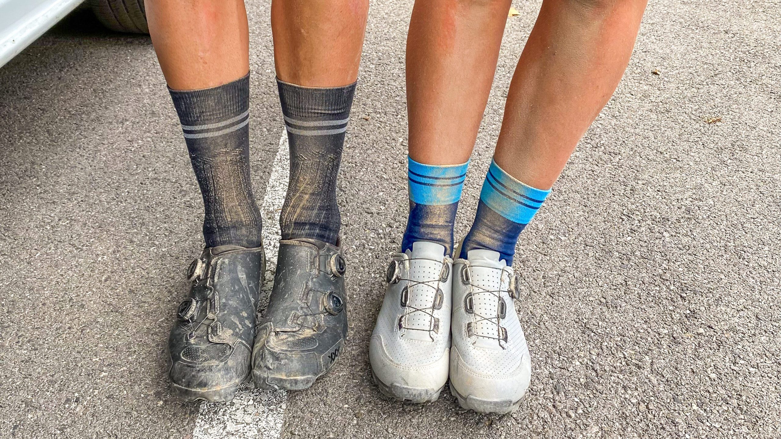 Two gravel cyclists and their dirty socks.